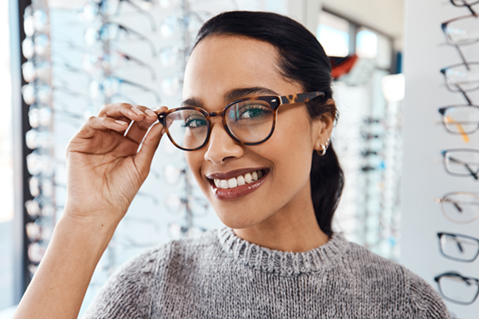 Woman trying on new glasses